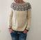 Maglione in lana beige con motivi geometrici da donna