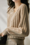 Pull en maille torsadée beige pour femme