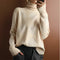 Pull en maille à col roulé motif losanges beige pour femme