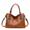 Sac à main en cuir marron avec bandoulière amovible