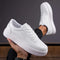 Chaussures de sport blanches en toile pour homme
