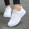 Chaussures de sport blanches pour femme, lacets, semelle texturée