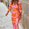 Robe portefeuille rayée rose et orange à manches longues