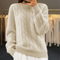 Pull en laine torsadé beige pour femme