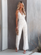 Elegante tuta da donna in pizzo bianco senza maniche