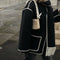 Manteau en laine noir avec bordures blanches et franges