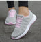 Chaussures de course femme grises et roses avec lacets