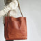 Sac à main en cuir marron avec bandoulière ajustable