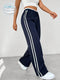 Pantalon de jogging sportif à taille haute avec rayures