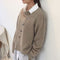 Cardigan da donna in lana beige con bottoni